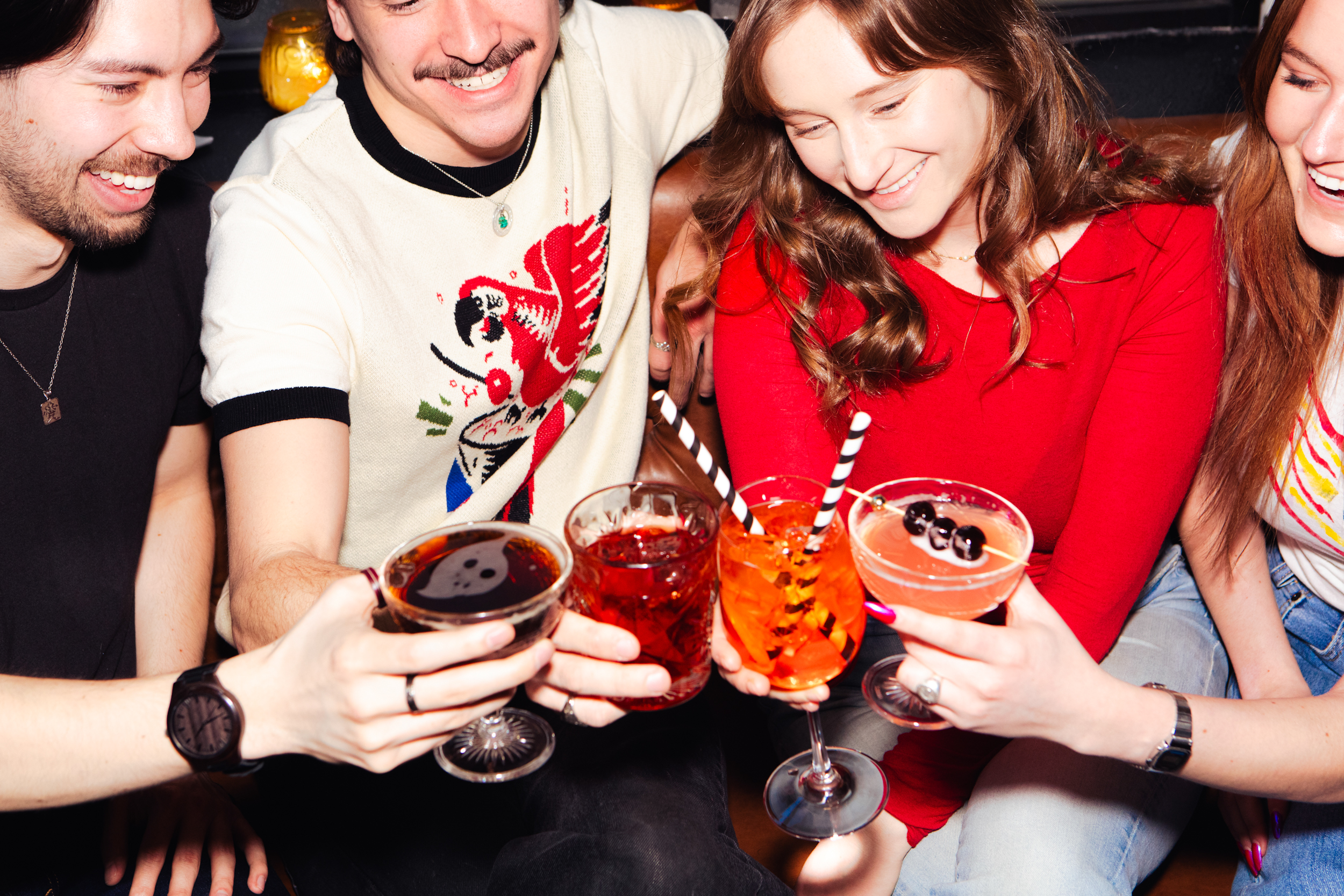 Friends enjoying cocktails at Artie’s Backroom & Rooftop bar in Murray Hill NYC