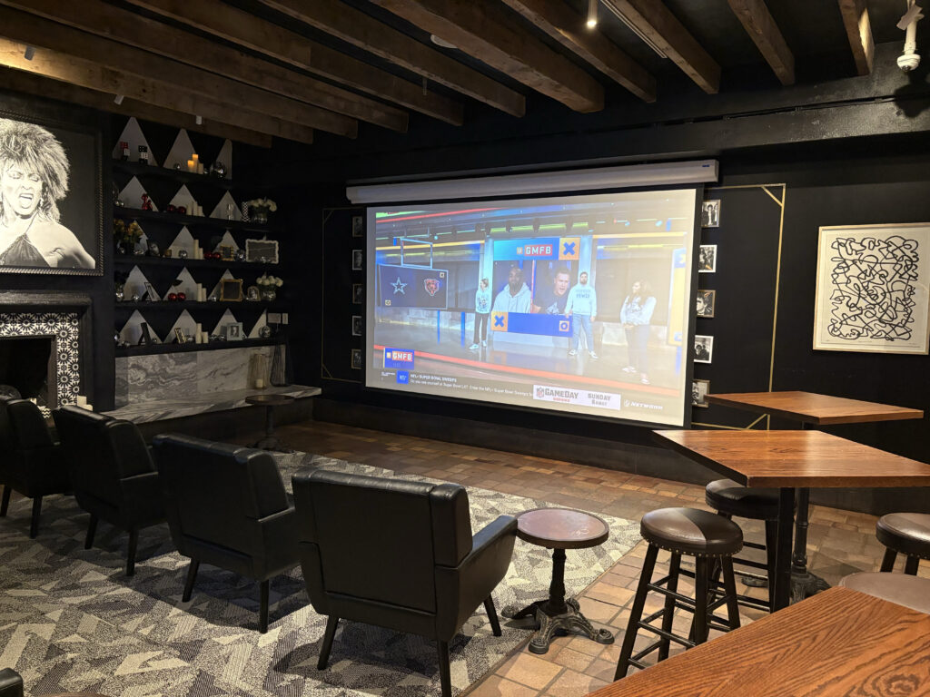 Artie’s NYC sports bar with massive TV screen for live games